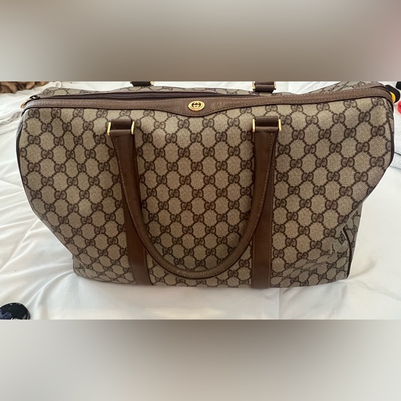 Gucci Handbags - Gucci Beige and Brown GG Monogram duffel.